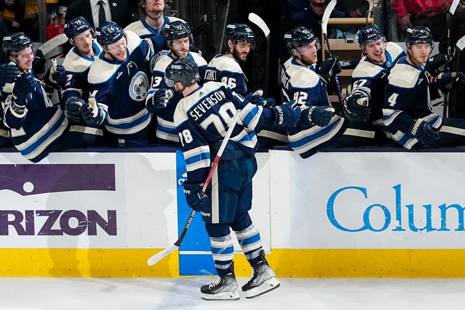 Mar 30, 2024; Columbus, Ohio, USA; Columbus Blue Jackets defenseman Damon Severson (78) gets high fives from the. bench after scoring during a shootout in the NHL hockey game against the Pittsburgh Penguins at Nationwide Arena. The Blue Jackets won 4-3 in a shootout.