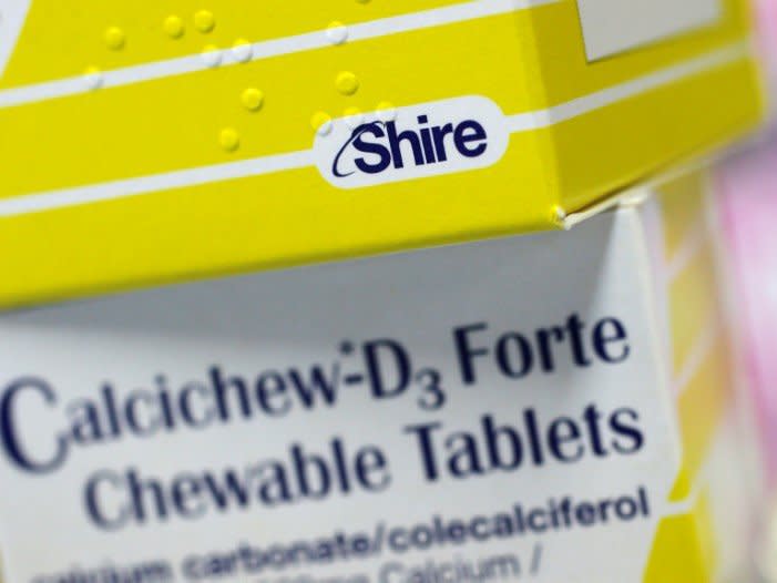 FILE PHOTO: Vitamins made by Shire are displayed at a chemist's in northwest London, Britain, July 11, 2014.  REUTERS/Suzanne Plunkett/File Photo