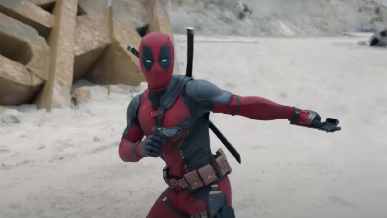  A costumed Wade Wilson stylishly reloads his pistols in Deadpool 3. 