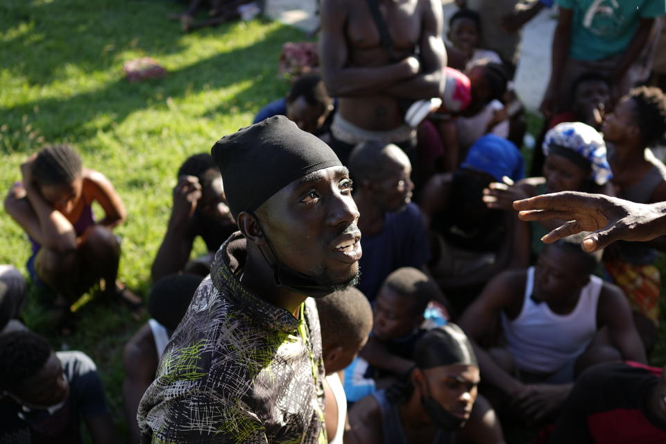 A Haitian migrant provides his personal data at a tourist campground in Sierra Morena, in the Villa Clara province of Cuba, Wednesday, May 25, 2022. A vessel carrying more than 800 Haitians trying to reach the United States wound up instead on the coast of central Cuba, government news media said Wednesday. (AP Photo Ramon Espinosa)