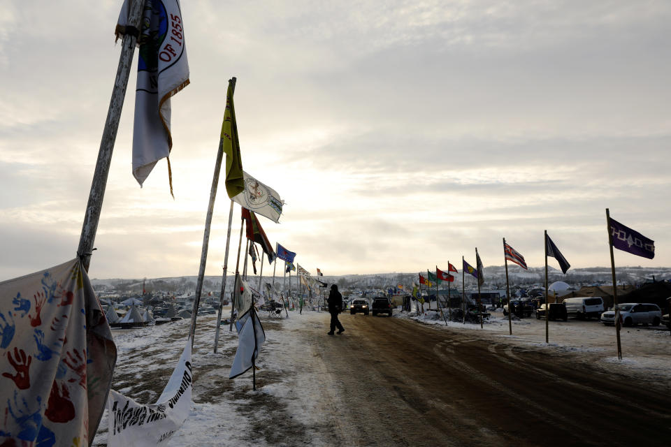 A camper crosses "flag road" inside the Oceti Sakowin camp.