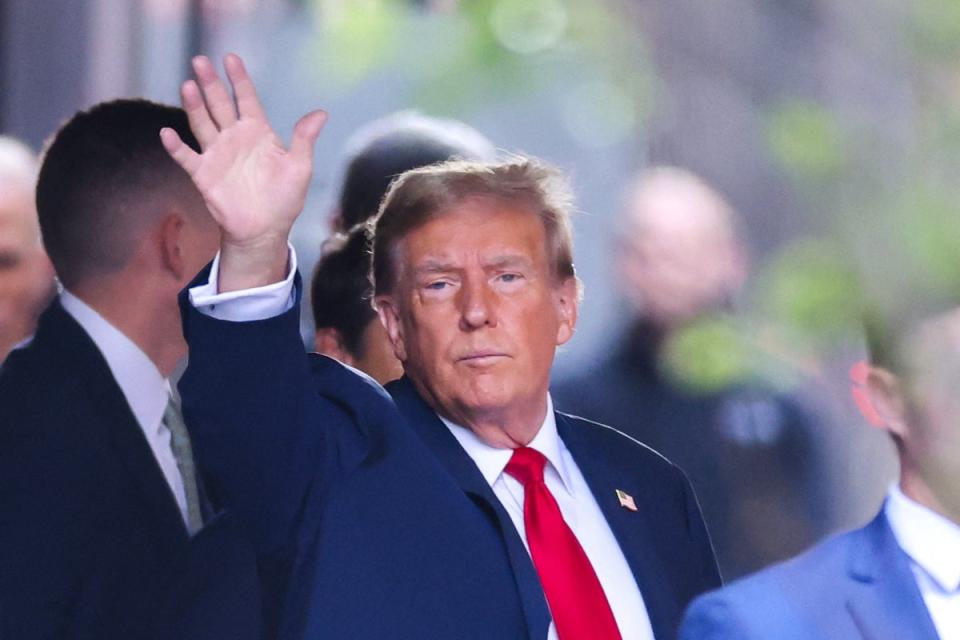 Mr Trump leaving Trump Tower to attend the first day of the hush money trial (AFP via Getty Images)