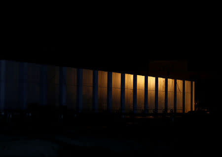 A seawall is illuminated at night in Yamada village, Iwate Prefecture, Japan, March 2, 2018. REUTERS/Kim Kyung-Hoon