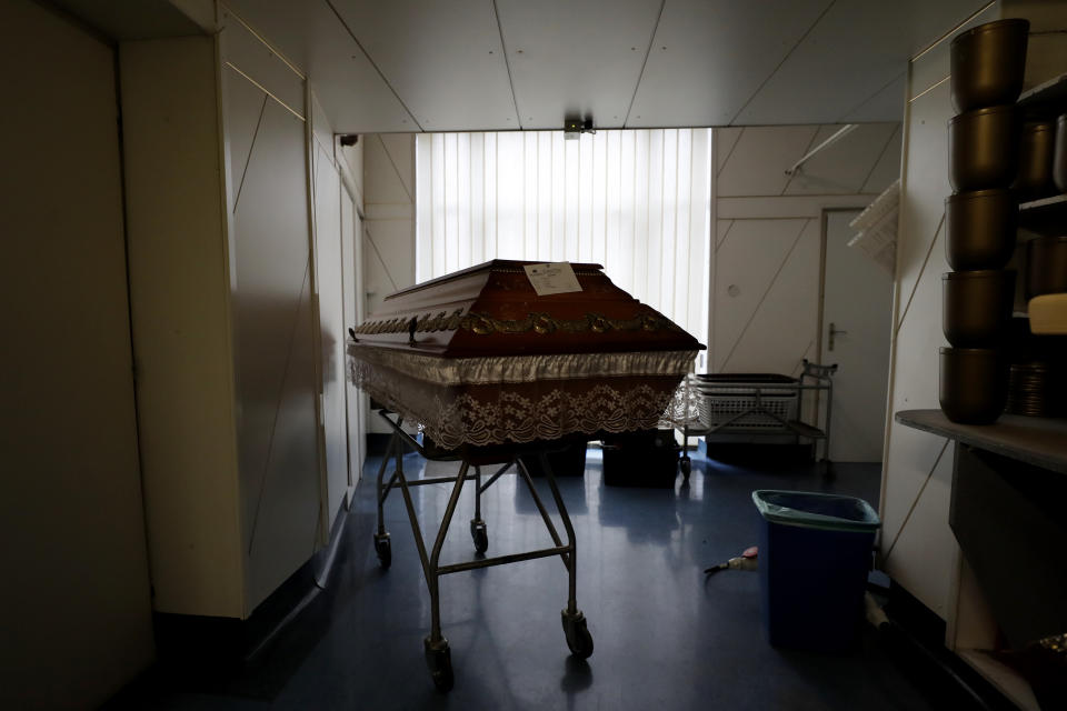 A casket is placed in a hallway at a crematorium in Ostrava, Czech Republic, Thursday, Jan. 7, 2021. The biggest crematorium in the Czech Republic has been overwhelmed by mounting numbers of pandemic victims. With new confirmed COVID-19 infections around record highs, the situation looks set to worsen. Authorities in the northeastern city of Ostrava have been speeding up plans to build a fourth furnace but, in the meantime, have sought help from the government’s central crisis committee for pandemic coordination. (AP Photo/Petr David Josek)