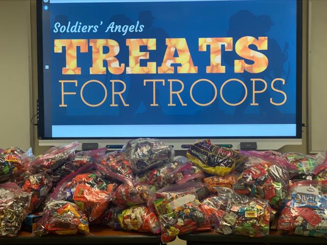 GOOD DEEDS Collecting treats for the troops, delivering food to the hungry picture