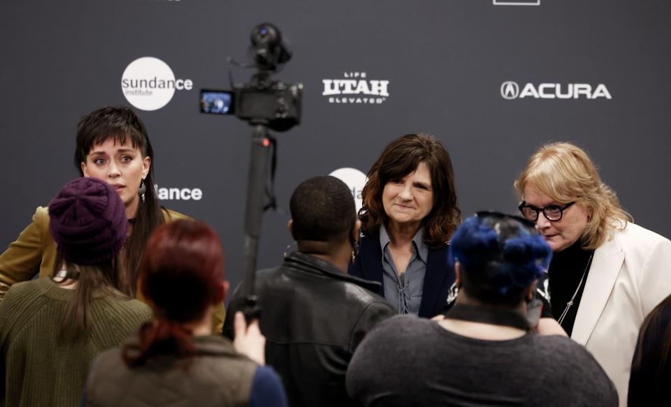 Director Alexandria Bombach, left, and Amy Ray and Emily Saliers of the Indigo Girls speak to reporters at the premiere of their documentary film “It’s Only Life After All” at the Ray Theatre in Park City on Thursday, Jan. 19, 2023. | Laura Seitz, Deseret News