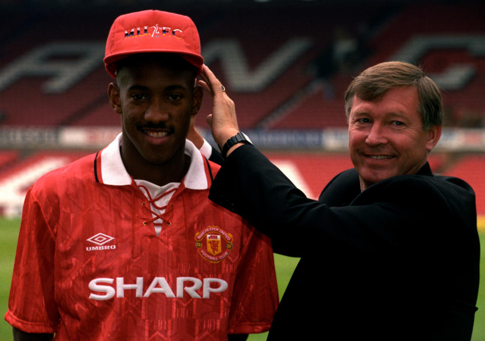 Alex Ferguson (R), with Dion Dublin, who is all smiles after being signed by Manchester United for 1 million pounds from Cambridge United.   (Photo by PA Images via Getty Images)