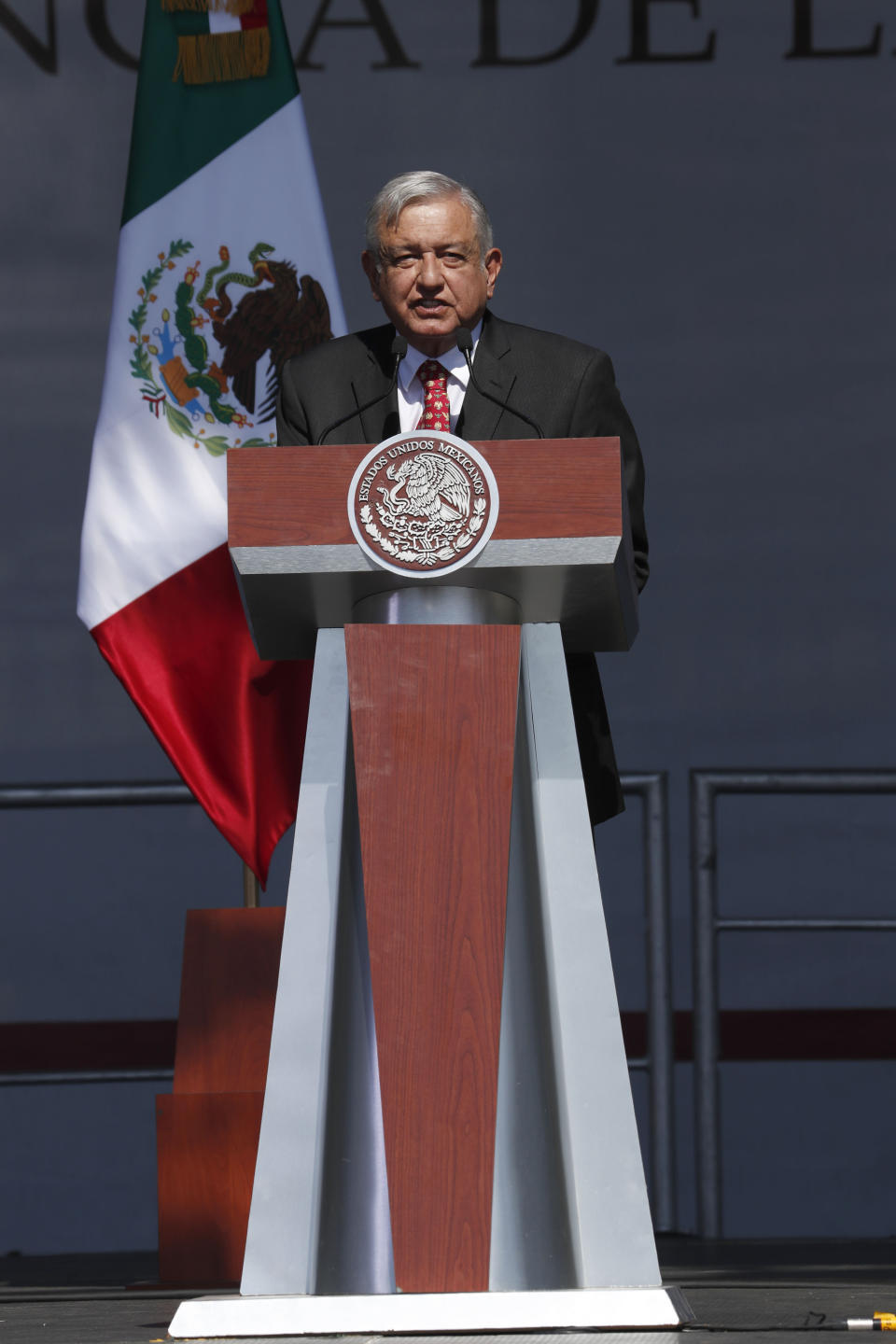 Mexico's President Andres Manuel Lopez Obrador speaks during a rally to commemorate his one year anniversary in office, at the capital's main plaza, the Zocalo, in Mexico City, Sunday, December 1, 2019. Thousands of Mexicans have packed into the capital's central square to celebrate Lopez Obrador's first year in office, while thousands more marched down the city's main avenue to protest violence and other ills in the country. (AP Photo/Marco Ugarte)