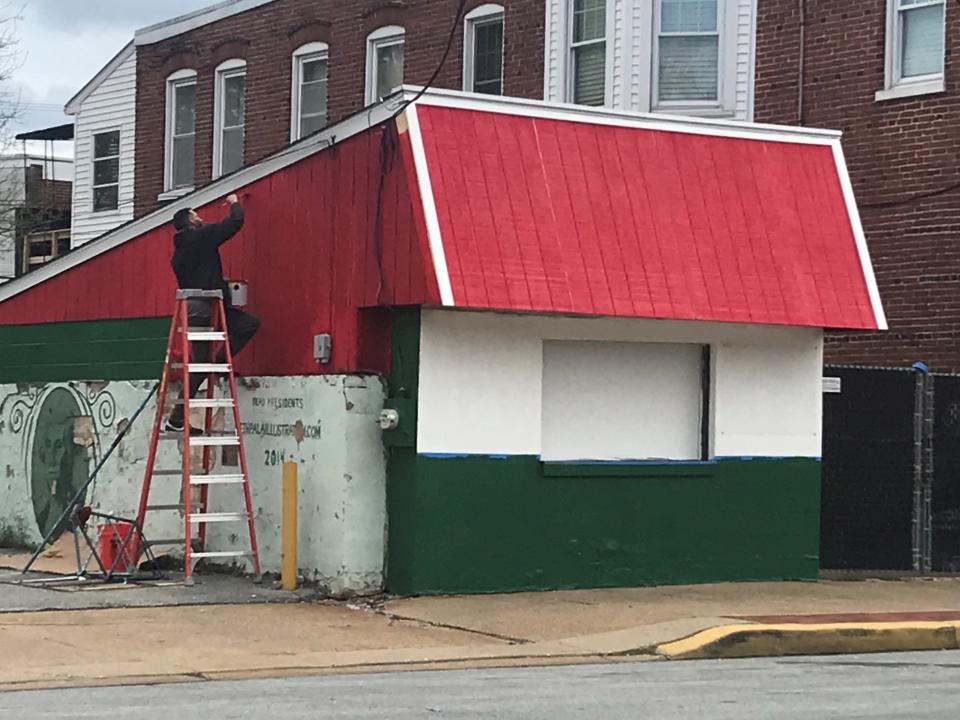 A worker on Tuesday afternoon puts a coat of paint on the iconic Fusco's Water Ice stand on Wilmington's Union Street. The longtime family business is reopening for business around Memorial Day after a 7-year absence.