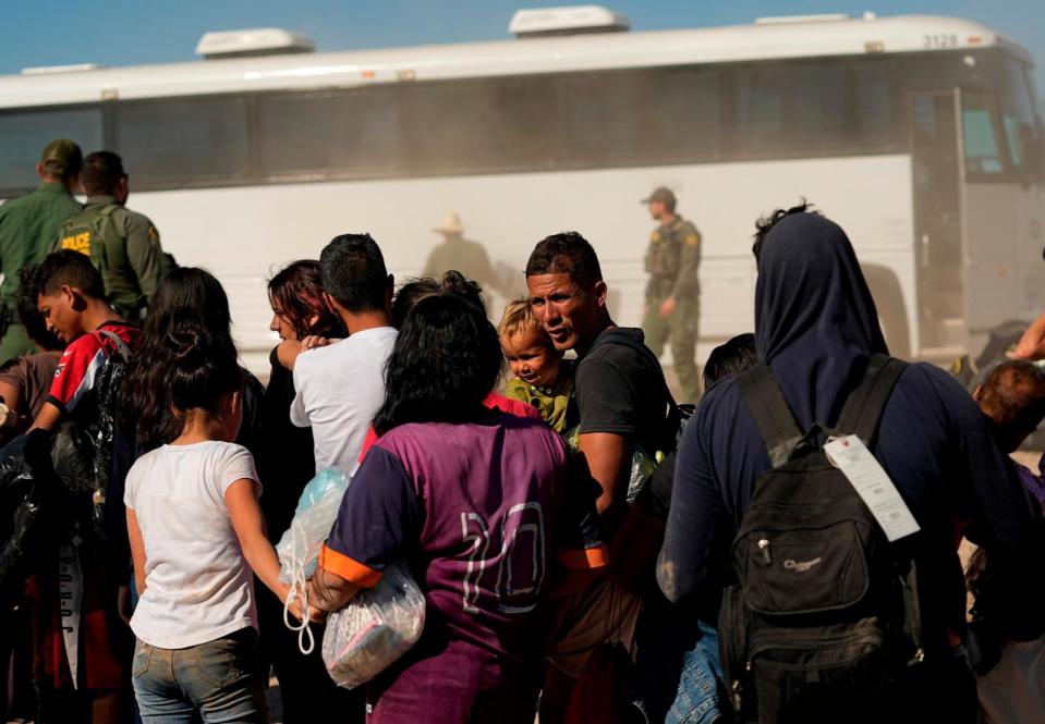 PHOTO: Migrants wait to board busses as they are processed by the U.S. Customs and Border Patrol after they crossed the Rio Grande and entered the U.S. from Mexico, Oct. 19, 2023, in Eagle Pass, Texas. (Eric Gay/AP)