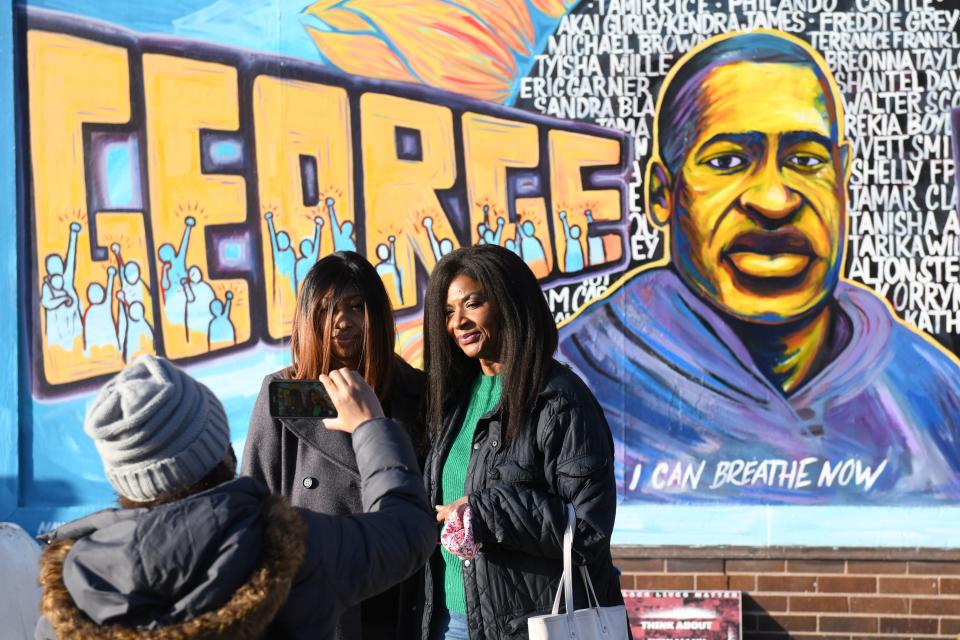 Angela Harrelson (wearing green), George Floyd’s aunt, at the renamed George Floyd SquareREUTERS