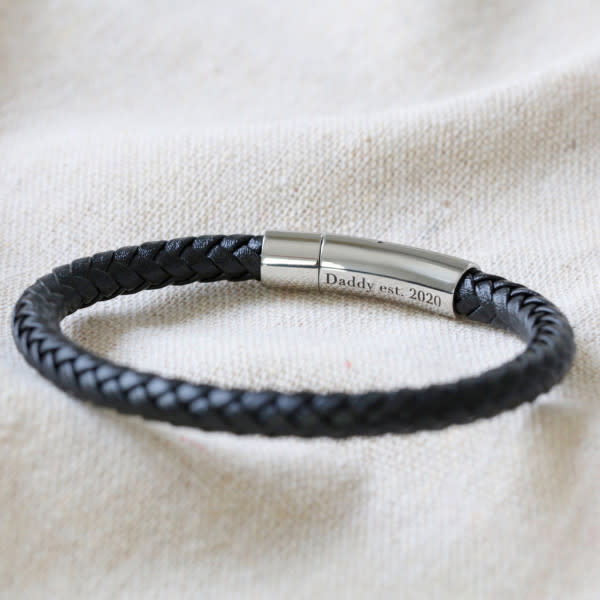 A black plaited Men's Personalised Engraved Leather Bracelet by Lisa Angel, $69.90, with silver clasp with Daddy engraving.