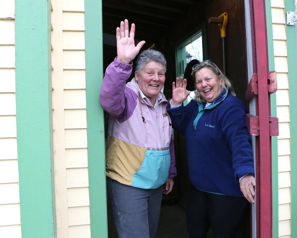 Bonnie Clement, left, and Helen Thorgalsen wave goodbye after owning and operating H.B. Provisions for the past 22 years.