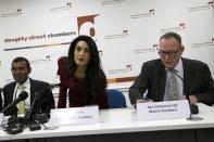 Lawyer Amal Clooney (C) takes her place by Mohamed Nasheed at the start of a news conference in central London, Britain January 25, 2016. REUTERS/Stefan Wermuth