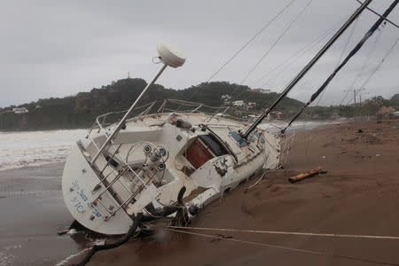 A damaged boat is pictured on the shore of San Juan del Sur Bay after tropical storm Nate in San Juan del Sur, Nicaragua October 6,2017.REUTERS/Oswaldo Rivas