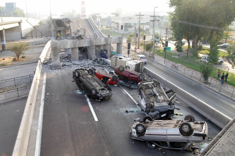 Wrecked vehicles are seen on a destroyed highway in Santiago, Chile, on February 28, 2010, after an 8.8-magnitude earthquake struck the country on February 27. File Photo by Ivan Lepe/UPI