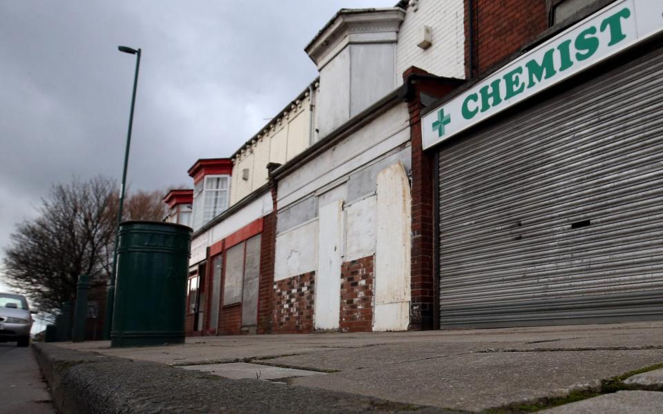 A shuttered pharmacy is too familiar a sight today - Nigel Roddis/Getty Images