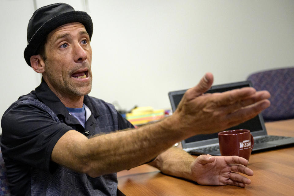 Paul Carpenter, a New Orleans magician, speaks during an interview in New Orleans, Friday, Feb. 23, 2024. Carpenter says he was hired in January by Steve Kramer, who has worked on ballot access for Democratic presidential candidate Dean Phillips, to use AI software to imitate President Joe Biden's voice to convince New Hampshire Democrat voters not to vote in the state's presidential primary. (AP Photo/Matthew Hinton)