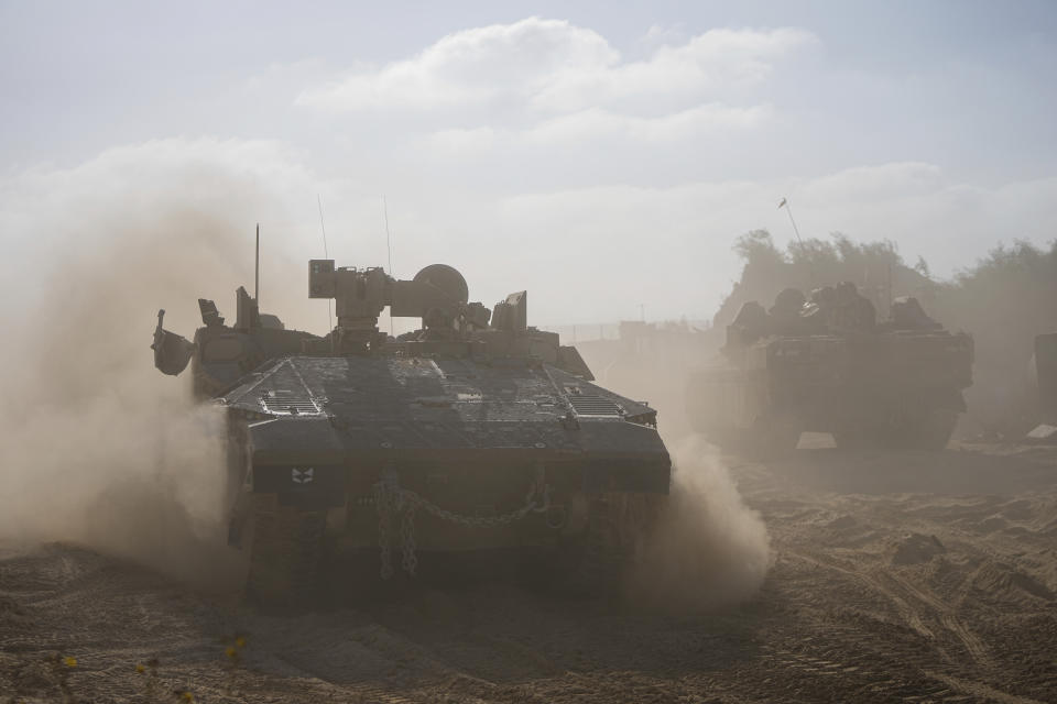 Israeli armored personnel carriers are seen on the Israeli-Gaza border during a ground operation in the Gaza Strip, Wednesday, Nov. 8, 2023. Israeli ground forces entered the Gaza Strip as they press ahead with their war against Hamas militants in retaliation for the group's unprecedented Oct. 7 attack on Israel. (AP Photo/Ohad Zwigenberg)