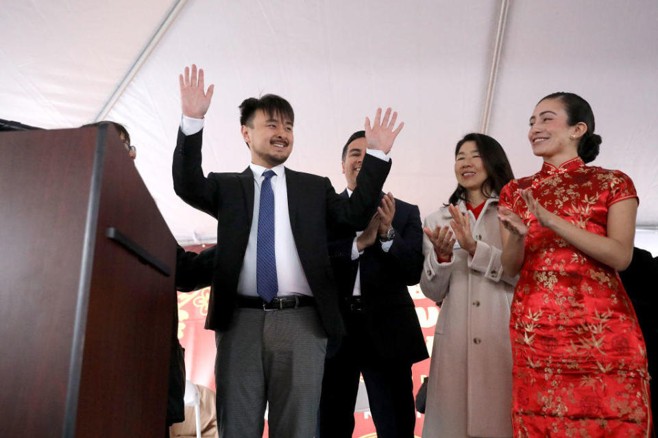 Brandon Tsay, 26, left, receives a medal of courage from the Alhambra Police Department on Sunday, Jan. 29, 2023, in Alhambra, California. / Credit: Gary Coronado/Los Angeles Times via Getty Images