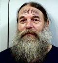 Oregonian Lance McKenzie, 49, served a 60-day sentence for assault. It is unclear whether "Lick Me" on his forehead is a real tattoo or written with marker pen. For his sake, let's hope it's the latter.