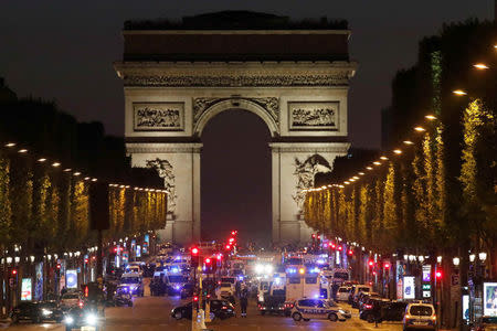 Police secure the Champs Elysees Avenue after one policeman was killed and another wounded in a shooting incident in Paris, France, April 20, 2017. REUTERS/Christian Hartmann