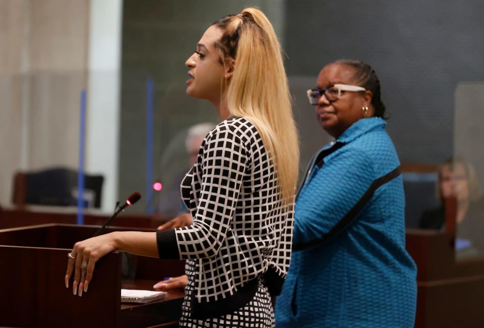 Director of the Transgender Advocacy Fair Michigan Julisa Abad, left, and Wayne County Prosecutor Kym Worthy at the Wayne County Commission meeting in downtown Detroit on Wednesday, June 29, 2022.