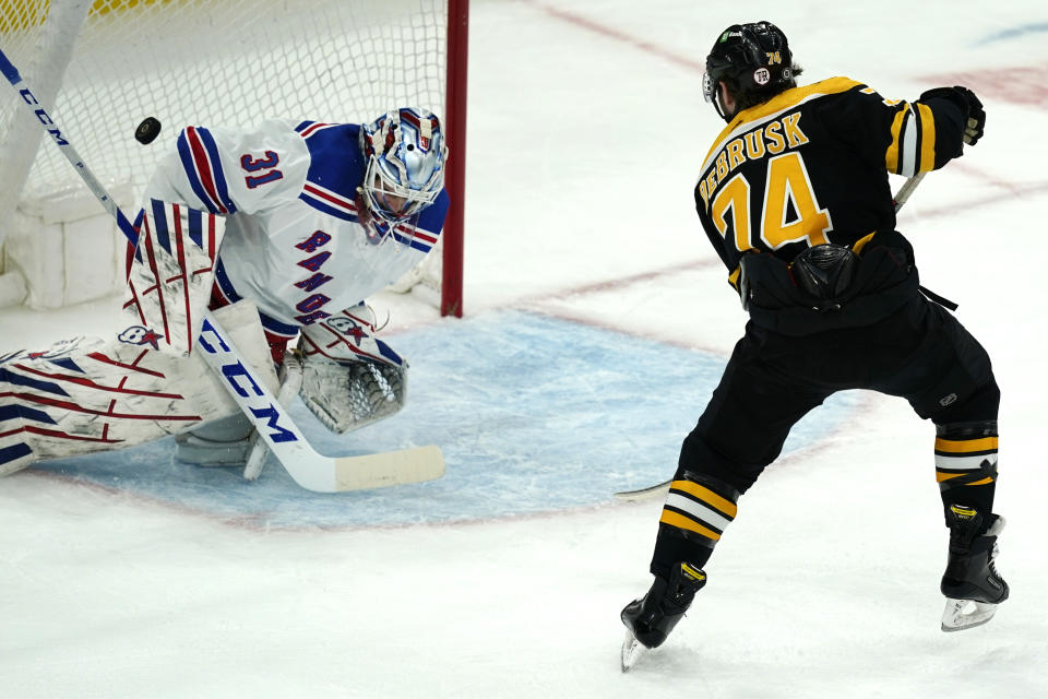 Boston Bruins left wing Jake DeBrusk (74) scores against New York Rangers goaltender Igor Shesterkin (31) on a breakaway in the second period of an NHL hockey game, Thursday, May 6, 2021, in Boston. (AP Photo/Elise Amendola)