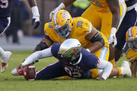 Jackson State defensive lineman Justin Ragin (92) recovers a Southern University fumble during the first half of the Southwestern Athletic Conference championship NCAA college football game Saturday, Dec. 3, 2022, in Jackson, Miss. (AP Photo/Rogelio V. Solis)