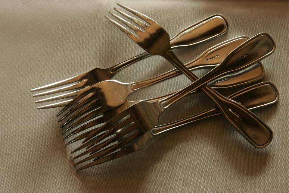 A handful of forks awaits their placement as restaurants prepare for Providence Restaurant Weeks. This photo accompanied the first story on the event back in 2006.