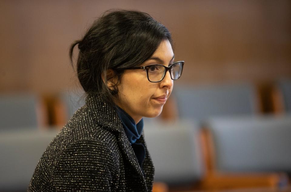 Deputy District Attorney Evelyn Centeno speaks to a defense attorney during an end of jurisdiction hearing.