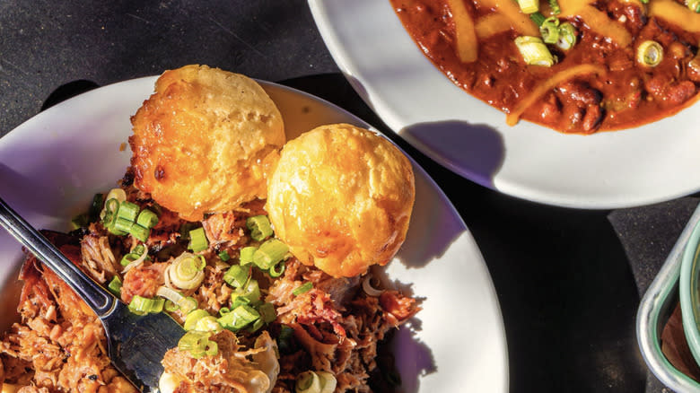 Cornbread muffins on plate of food