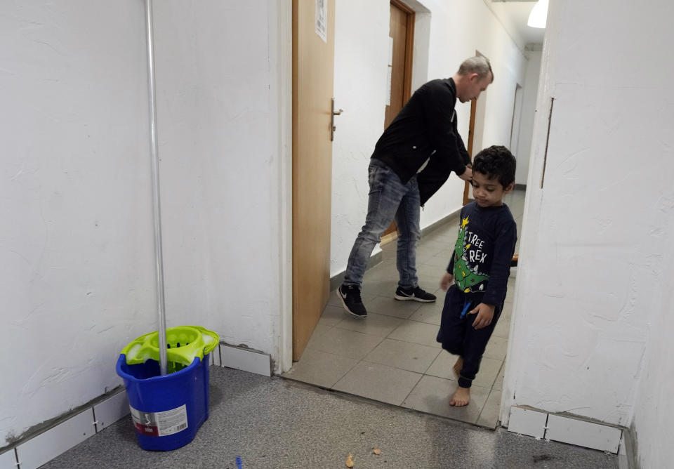 A boy play at a refugee center in Bialystok, Poland, on Wednesday, Sept. 29, 2021. After enduring a decade of war in Syria, Boshra al-Moallem and her two sisters seized their chance to flee, but the journey proved terrifying and nearly deadly. Al-Moallem, originally from Homs but who displaced to Damascus by the war, is one of thousands of people who have traveled to Belarus in recent weeks and then found herself helped to cross the border with the help of Belarusian guards, something the EU considers a form of “hybrid war” waged against the bloc with the use of human lives. (AP Photo/Czarek Sokolowski)