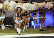 St. Louis Rams cheerleaders perform before a preseason NFL football game.