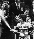 After their victories in Monaco 41st Grand Prix Formula One race, Brazilian pilot Nelson Piquet second in the race spray champagne on May 15, 1983 in Monaco, (l to r background) S.A.S Princess Caroline of Monaco, Keke Rosberg of Finland the winner of race, man with glass unidentified, and the French pilot Alain Prost third of the race. (AP Photo)