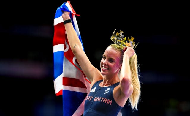 Keely Hodgkinson wears a crown after winning 800 metres gold at the Paris Olympics, holding a union flag. 