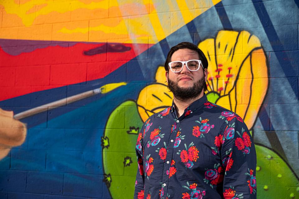 Visual artist Patrick Gabaldon on Sept. 17, 2020, stands in front of a mural dedicated to him in Central El Paso.