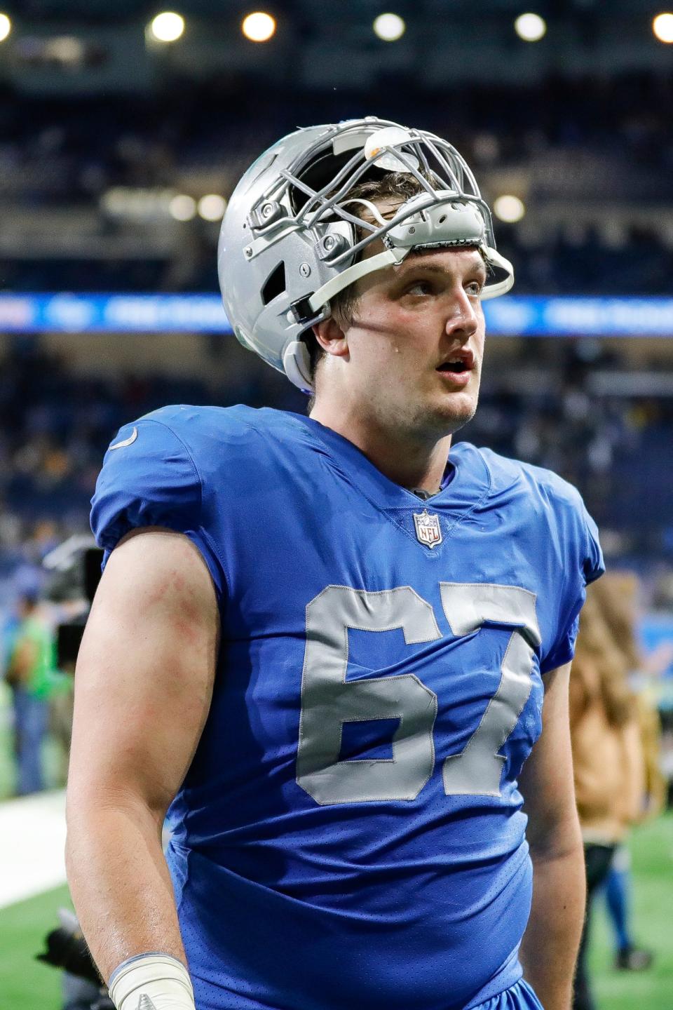 Lions offensive tackle Matt Nelson walks off the field after the Lions' 37-30 win over the Packers on Sunday, Jan. 9, 2022, at Ford Field..