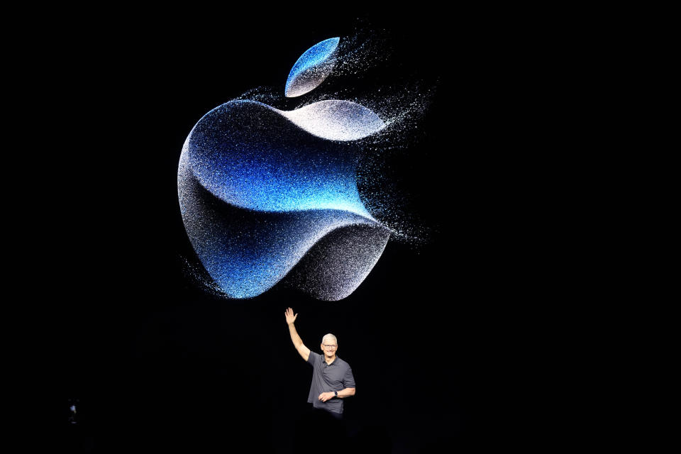 Apple CEO Tim Cook waves as he walks to the stage during an announcement of new products on the Apple campus Tuesday, Sept. 12, 2023, in Cupertino, Calif. (AP Photo/Jeff Chiu)