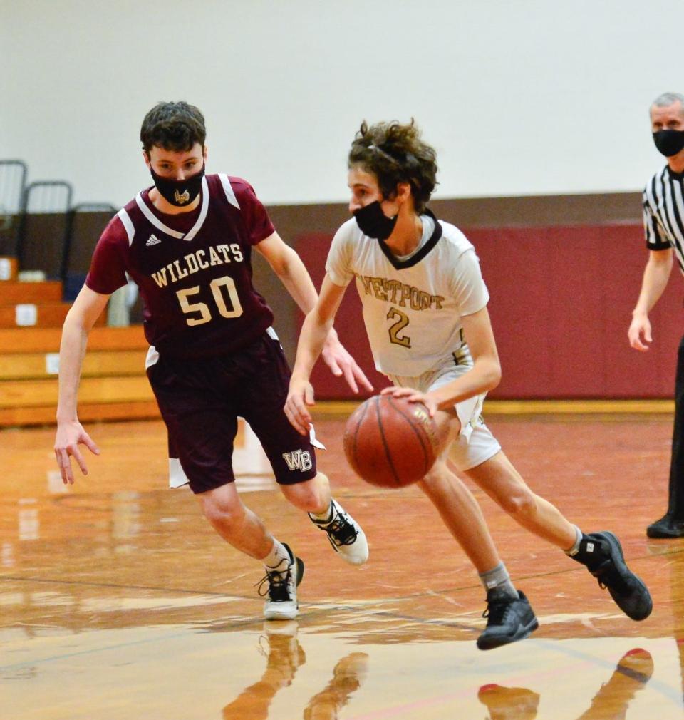 Westport's Ben Boudria, right, drive to the basket.