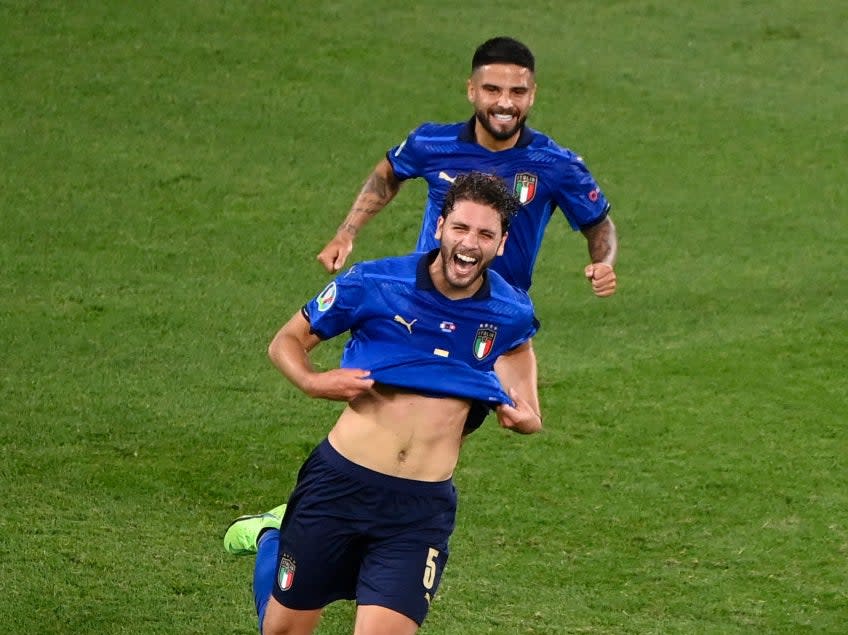 Manuel Locatelli celebrates scoring for Italy (POOL/AFP via Getty Images)