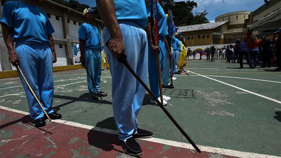 Inmates receive military training in a Venezuela prison. Photo: Juan Baretto/AFP