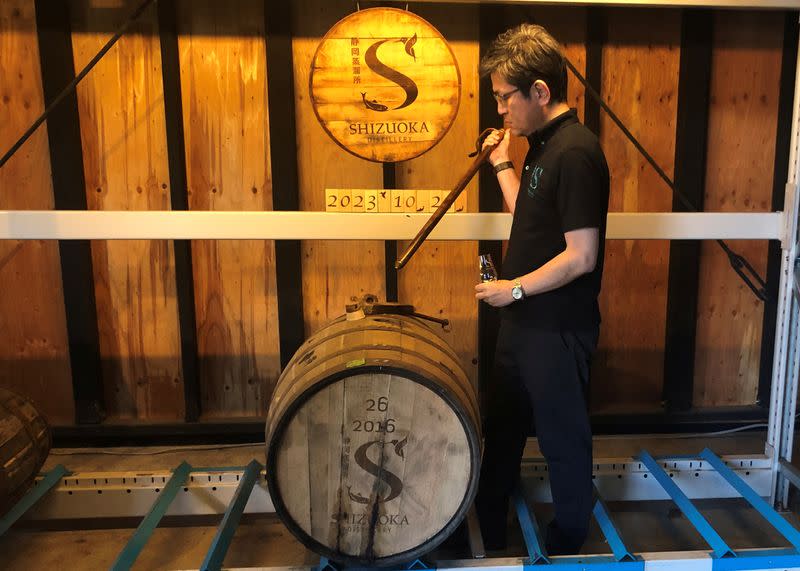 Taiko Nakamura samples whisky barreled in the year he founded at his distillery in Shizuoka