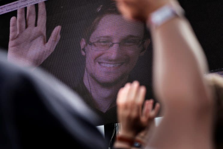 Revelers react as Edward Snowden is seen on a screen during the Roskilde Festival in Roskilde, Denmark, on June 28, 2016. (Photo: Scanpix Denmark/Mathias Loevgreen Bojesen /via Reuters)