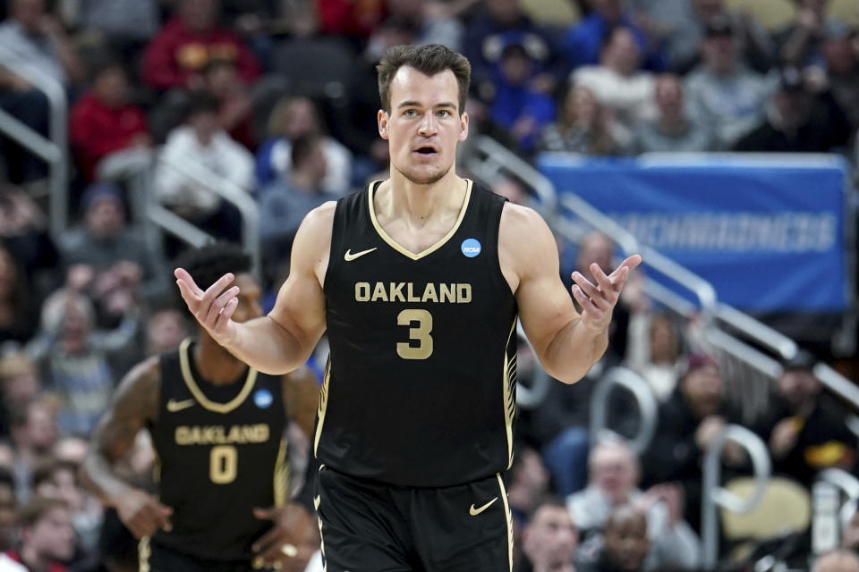 Oakland's Jack Gohlke (3) celebrates after shooting a 3-point shot during the first half of a second-round college basketball game in the NCAA Tournament against North Carolina State Saturday, March 23, 2024, in Pittsburgh. (AP Photo/Matt Freed)