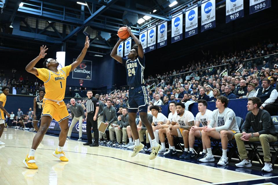 Akron forward Ali Ali shoots a 3-pointer Friday against Toledo in Akron.