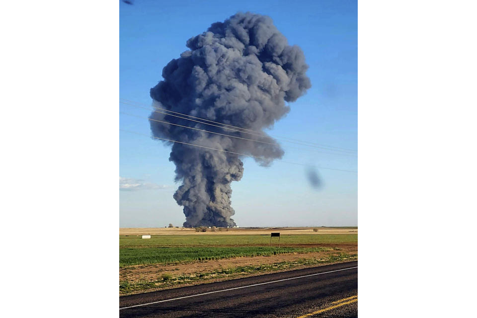 FILE - In this photo provided by Castro County Emergency Management, smoke fills the sky after an explosion and fire at the Southfork Dairy Farms near Dimmitt, Texas, on April 10, 2023. A fire and explosion at the dairy farm in the Texas Panhandle that critically injured one person and killed an estimated 18,000 head of cattle was an accident that started with an engine fire in a manure vacuum truck cleaning part of the massive barn, according to state investigators in a report on April 24. (Castro County Emergency Management via AP, File)