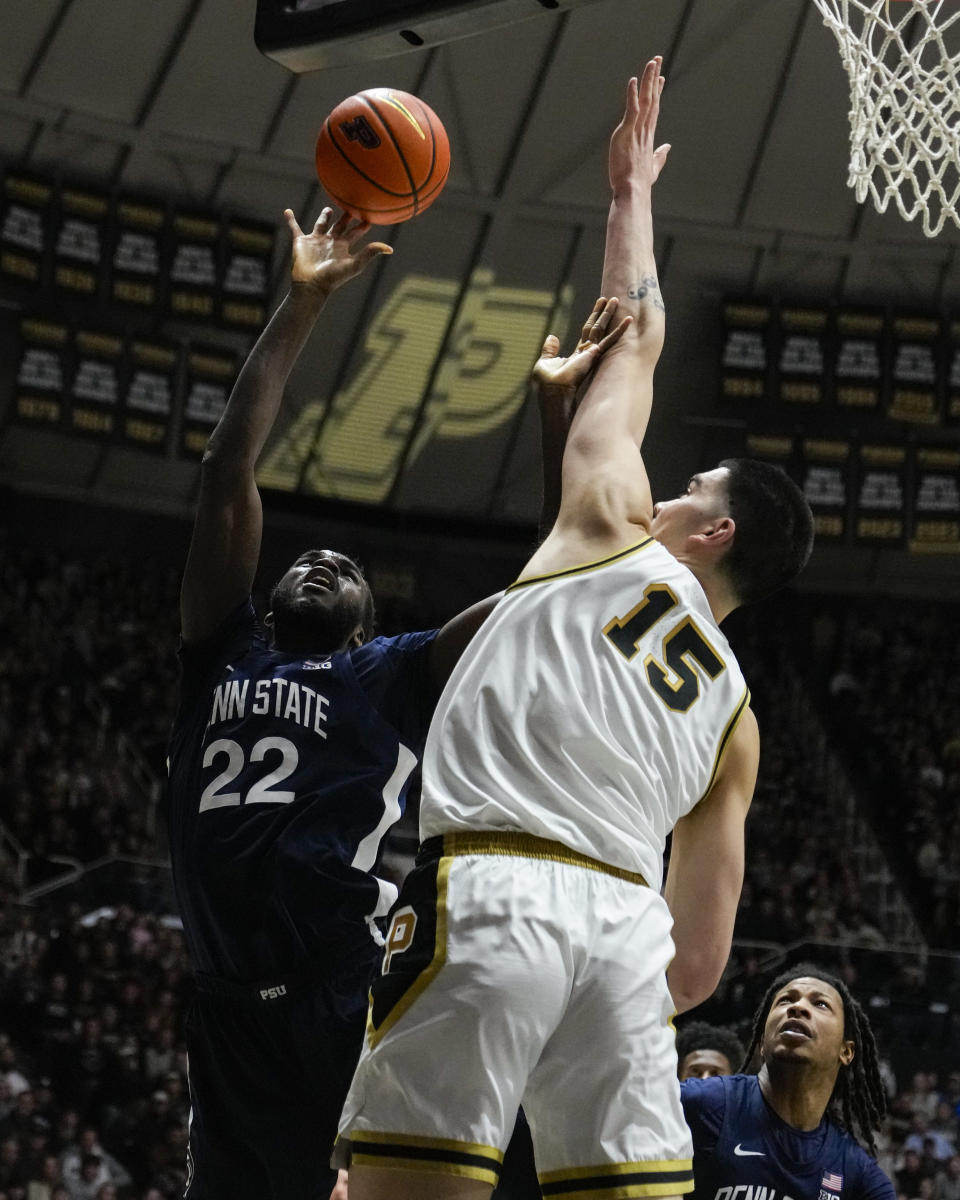 Penn State forward Qudus Wahab (22) shoots over Purdue center Zach Edey (15) during the first half of an NCAA college basketball game in West Lafayette, Ind., Saturday, Jan. 13, 2024. (AP Photo/Michael Conroy)