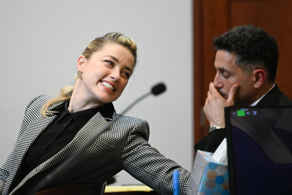 Actor Amber Heard looks on in the courtroom at the Fairfax County Circuit Courthouse in Fairfax, Va., Tuesday, May 24, 2022. Depp sued his ex-wife Amber Heard for libel in Fairfax County Circuit Court after she wrote an op-ed piece in The Washington Post in 2018 referring to herself as a "public figure representing domestic abuse." (Jim Watson/Pool photo via AP)