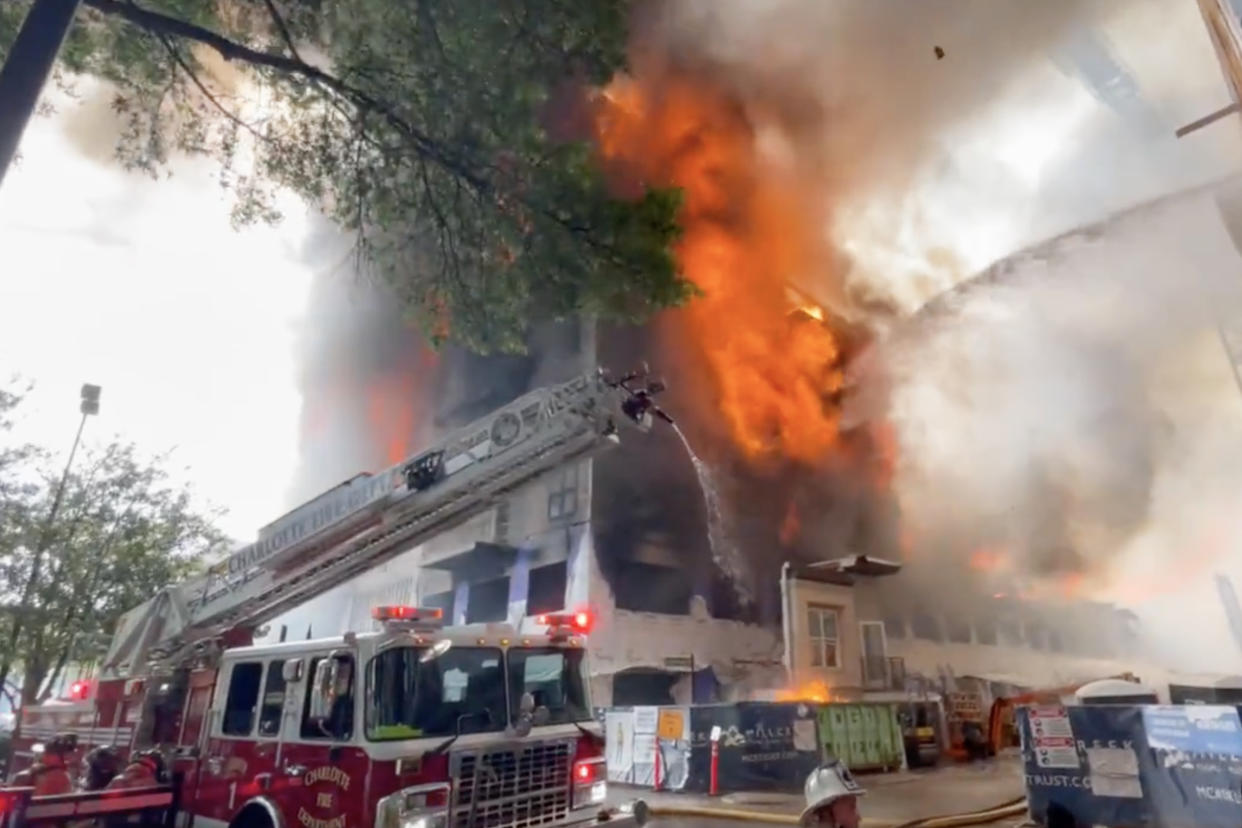 A fire burns at a construction site in Charlotte, N.C. (Charlotte Fire Department via Twitter)